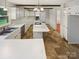 Bright kitchen features an island cooktop, ample counter space, and abundant white cabinetry at 3203 Oakdale Dr, Monroe, NC 28110