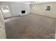 Spacious living room with bright white brick fireplace at 3203 Oakdale Dr, Monroe, NC 28110