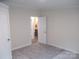 Carpeted bedroom with neutral walls with ensuite bathroom and closets at 3315 Buffalo Shoals Rd, Newton, NC 28658