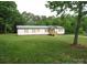 Charming single-story home with a well-maintained lawn and metal roof at 3315 Buffalo Shoals Rd, Newton, NC 28658