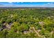 Aerial view of a wooded homesite, highlighting property lines and surrounding lush greenery at 341 N Mulberry St, Statesville, NC 28677