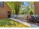 Brick house with a white picket fence and a well-manicured lawn at 341 N Mulberry St, Statesville, NC 28677