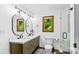 Bright bathroom featuring dual sinks, modern fixtures, and a glass-enclosed shower at 341 N Mulberry St, Statesville, NC 28677