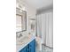 Cozy bathroom featuring a vanity with modern fixtures, complemented by patterned tiles and a shower-tub combo at 341 N Mulberry St, Statesville, NC 28677