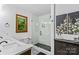 Stylish bathroom with dual sinks, a glass-enclosed shower, and modern fixtures at 341 N Mulberry St, Statesville, NC 28677