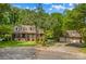 Charming two-story brick home with lush landscaping and a three-car garage in a desirable neighborhood at 341 N Mulberry St, Statesville, NC 28677