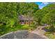 Attractive brick home with a manicured front lawn, mature trees, and inviting curb appeal at 341 N Mulberry St, Statesville, NC 28677
