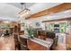 Open-concept layout seamlessly blends living, dining, and kitchen areas under timber beams at 341 N Mulberry St, Statesville, NC 28677