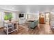 Bright living space featuring a living room and bed with hardwood floors and ample natural light at 341 N Mulberry St, Statesville, NC 28677