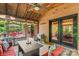 Stylish outdoor patio with a brick wall, cozy seating, and access to a deck perfect for entertaining at 341 N Mulberry St, Statesville, NC 28677