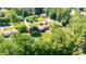 Expansive aerial view of a home nestled amongst lush, mature trees in a tranquil, established neighborhood at 3520 4Th Street Nw Blvd, Hickory, NC 28601