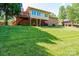 The spacious backyard includes mature trees, a deck, patio, and a brick home at 3520 4Th Street Nw Blvd, Hickory, NC 28601