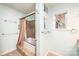 Well-lit bathroom features tiled shower and tub and a window perfect for relaxation at 3520 4Th Street Nw Blvd, Hickory, NC 28601