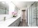 Stylish bathroom with marble counters, gray cabinetry, and a glass-enclosed shower at 3520 4Th Street Nw Blvd, Hickory, NC 28601