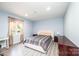 Comfortable bedroom featuring a large window, a work desk, and matching furniture at 3520 4Th Street Nw Blvd, Hickory, NC 28601