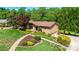 Well maintained lawn, mature trees and landscaping surround this brick home at 3520 4Th Street Nw Blvd, Hickory, NC 28601