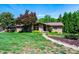 Charming brick home with stone accents, lush lawn, and mature landscaping at 3520 4Th Street Nw Blvd, Hickory, NC 28601