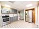 Updated kitchen features stainless steel appliances, gray cabinets, and laminate flooring for a modern look at 3520 4Th Street Nw Blvd, Hickory, NC 28601