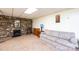 Cozy living area with a stone fireplace, vintage furniture, and hardwood floors at 3520 4Th Street Nw Blvd, Hickory, NC 28601