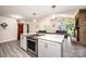 Open concept kitchen and living space with fireplace and stainless steel appliances at 3520 4Th Street Nw Blvd, Hickory, NC 28601