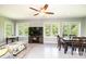 Cozy living area with ample windows, a ceiling fan, and dining space at 3520 4Th Street Nw Blvd, Hickory, NC 28601