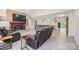 Open concept living room featuring a fireplace, kitchen, and modern gray flooring at 3520 4Th Street Nw Blvd, Hickory, NC 28601