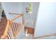 Inviting foyer featuring hardwood floors, staircase, and decorative lighting fixture at 3632 Cole Mill Rd, Charlotte, NC 28270