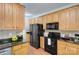Traditional kitchen featuring granite countertops and a full suite of black appliances at 3632 Cole Mill Rd, Charlotte, NC 28270