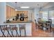 Bright eat-in kitchen featuring granite counters, wood cabinets and stainless steel appliances at 3632 Cole Mill Rd, Charlotte, NC 28270