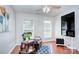 Bright living room with hardwood floors, ceiling fan, comfortable seating, and a tv at 3632 Cole Mill Rd, Charlotte, NC 28270