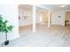 Spacious finished basement with luxury vinyl plank flooring and kitchenette at 383 Camden Nw Ct, Concord, NC 28027