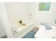 Bright bathroom featuring a white tiled shower and a relaxing bathtub at 383 Camden Nw Ct, Concord, NC 28027