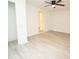 A clean bedroom showcasing ceiling fan and light-colored flooring and neutral walls at 383 Camden Nw Ct, Concord, NC 28027