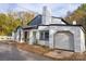 Lovely home featuring brickwork, an attached garage, and mature trees at 383 Camden Nw Ct, Concord, NC 28027