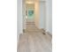 Bright hallway with luxury vinyl plank flooring at 383 Camden Nw Ct, Concord, NC 28027
