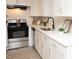 Modern kitchen featuring stainless steel appliances and white subway tile backsplash at 383 Camden Nw Ct, Concord, NC 28027