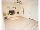 Cozy living room with brick fireplace, ceiling fan, and light blue door at 383 Camden Nw Ct, Concord, NC 28027