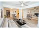 Open-concept living room with fireplace and modern gray furniture at 383 Camden Nw Ct, Concord, NC 28027