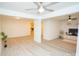 Spacious living room with modern ceiling fans, light-colored flooring, and great natural light at 383 Camden Nw Ct, Concord, NC 28027