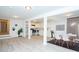 Open-concept living space with a stylish dining area and modern kitchen featuring stainless appliances at 383 Camden Nw Ct, Concord, NC 28027