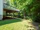 Large backyard area with a raised deck offering shade and scenic views, perfect for outdoor entertaining at 4028 Garden Oak Dr, Indian Trail, NC 28079