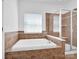 Bathroom with a large bathtub and a tiled shower stall at 4028 Garden Oak Dr, Indian Trail, NC 28079