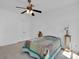 Bedroom with a double door closet, ceiling fan, bed with a colorful quilt at 4028 Garden Oak Dr, Indian Trail, NC 28079