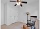 Bedroom with a ceiling fan, rocking chair, and a double door closet at 4028 Garden Oak Dr, Indian Trail, NC 28079