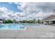 Community pool area featuring a spacious pool, lounge chairs and a clubhouse, perfect for summer relaxation at 4028 Garden Oak Dr, Indian Trail, NC 28079