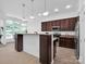 Modern kitchen features stainless steel appliances, granite countertops, and recessed lighting at 4028 Garden Oak Dr, Indian Trail, NC 28079