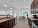 Bright kitchen with stainless steel appliances and eat-in breakfast area with large windows at 4028 Garden Oak Dr, Indian Trail, NC 28079