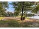 Community park featuring playground equipment and a scenic lakeside view, perfect for Gathering recreation at 4028 Garden Oak Dr, Indian Trail, NC 28079