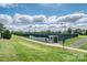 Well-maintained tennis court in a green community with ample lighting and a paved walkway at 4028 Garden Oak Dr, Indian Trail, NC 28079