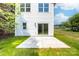 Back exterior view featuring sliding glass door and patio at 413 Jose St, Shelby, NC 28150